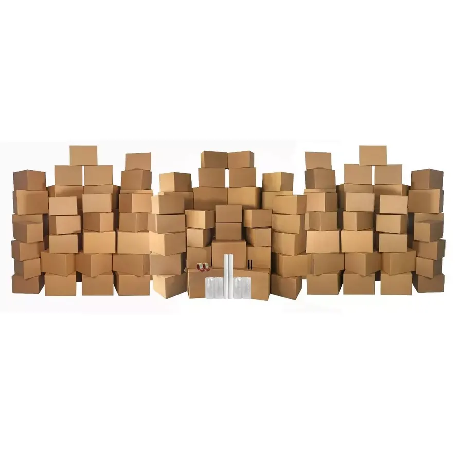 Large stacked bundles of brown corrugated moving boxes with packing supplies