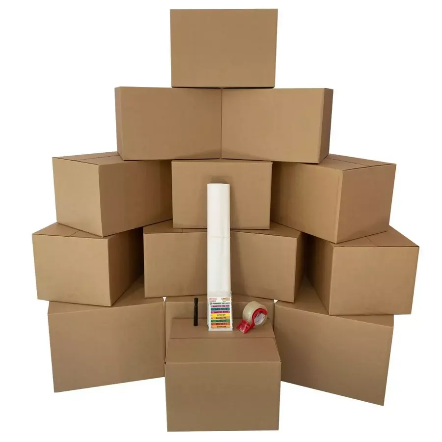 Bundle of large brown corrugated moving boxes with packing supplies
